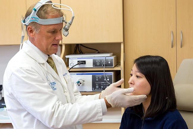 Dr. Terry Day examines a patient