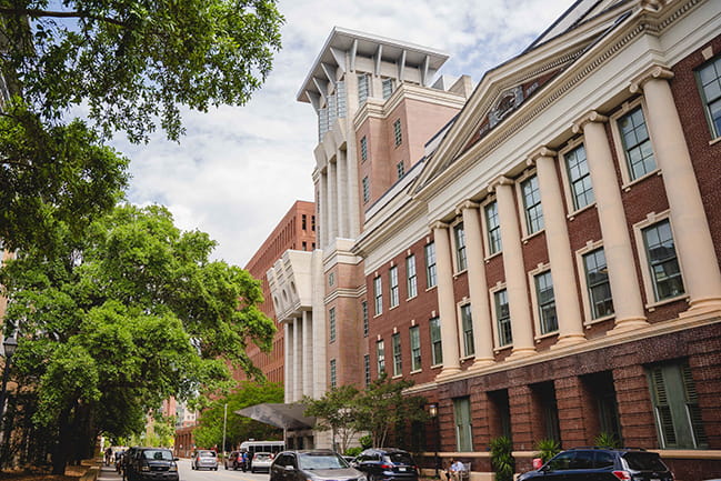 exterior shot of MUSC Hollings Cancer Center building showing historic facade and 7 story tower