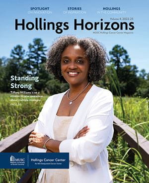 cover of Hollings Horizons 2022 featuring a woman standing on a boardwalk in a marsh