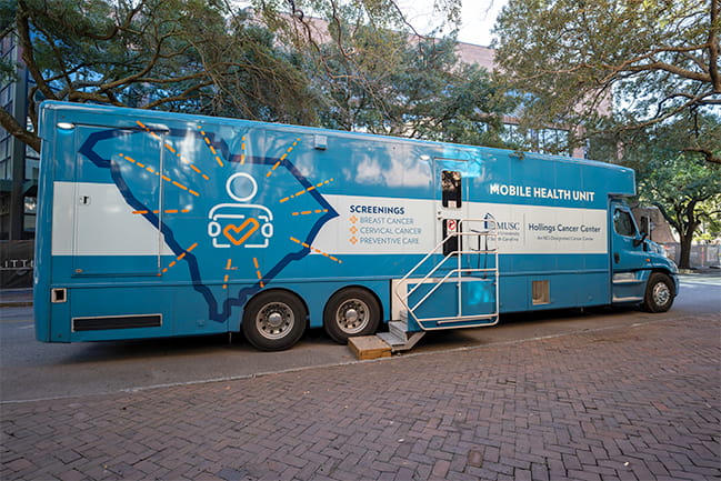 Hollings Mobile Health Unit truck parked on a college campus with the stairs out so people can enter the unit