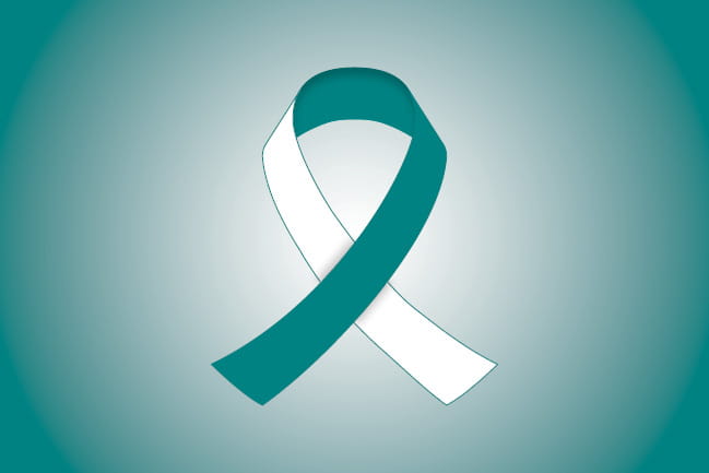 teal and white colored ribbon representing cervical cancer