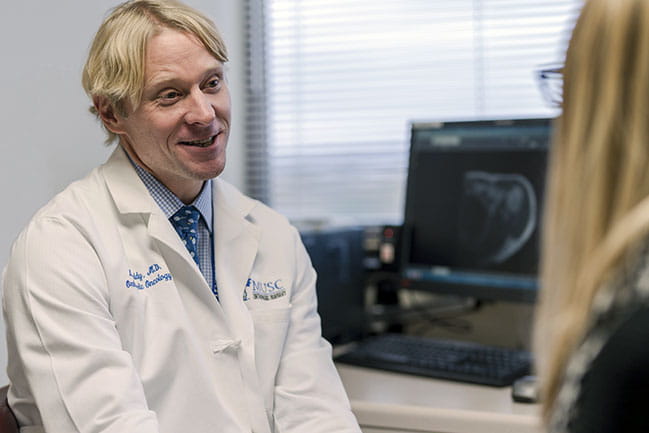 Dr. Lee Leddy in clinic at Hollings Cancer Center