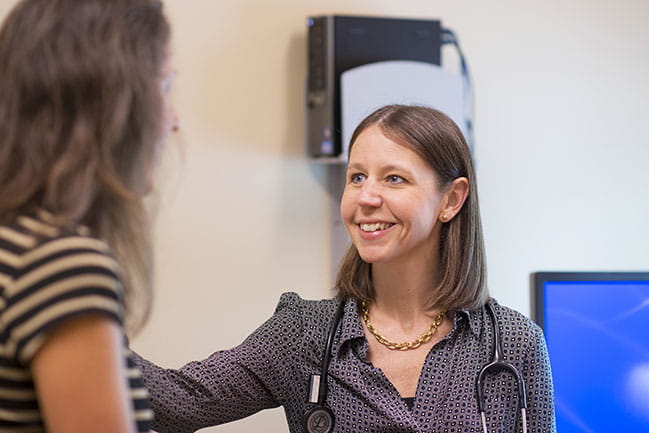 Dr. Rochelle Ringer talks with a patient