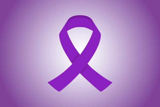 purple colored ribbon representing vaginal and vulvar cancer