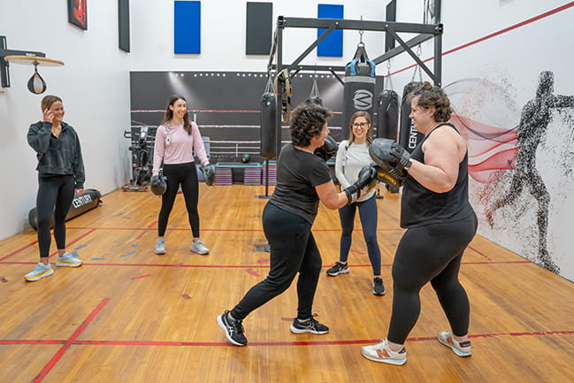 women doing boxing workout in gym