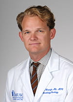 headshot of Dr. John Wrangle