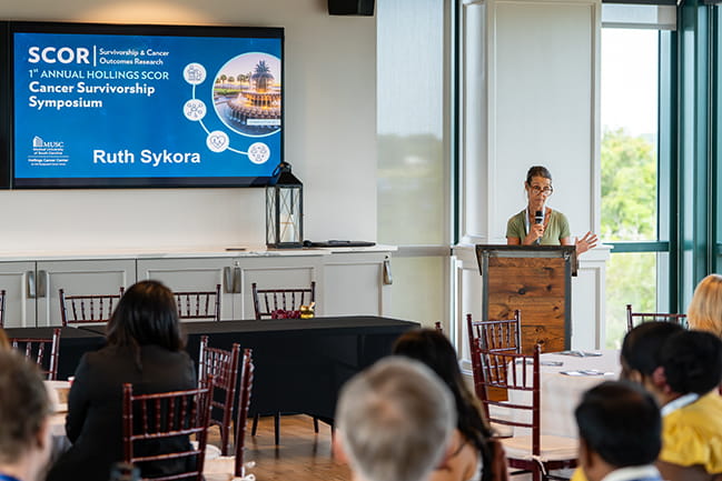 Ruth Sykora speaking as the patient keynote at the Scor Symposium