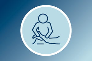 physical therapy icon showing a therapist working on a patient's leg