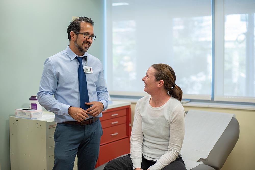Dr. Virgilio George with patient