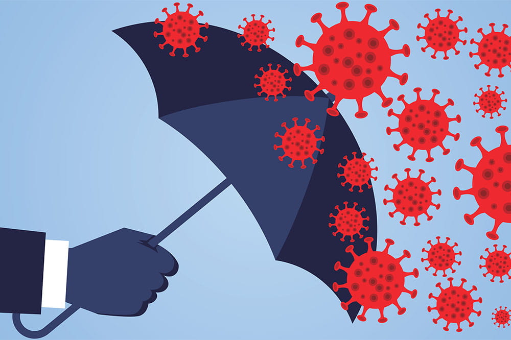 hand holding umbrella against coronavirus