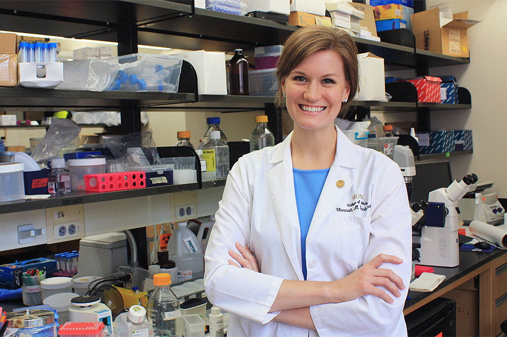 Hannah Knochelmann stands in the lab