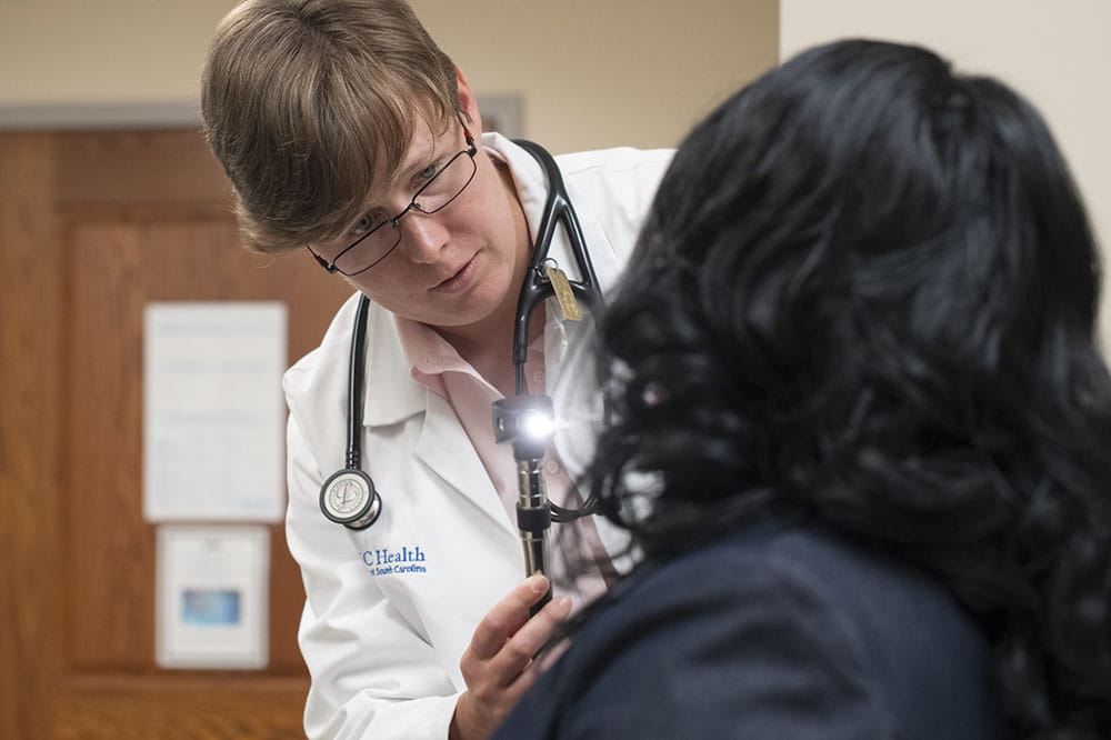 Dr. Sarah Tucker Price examines a patient