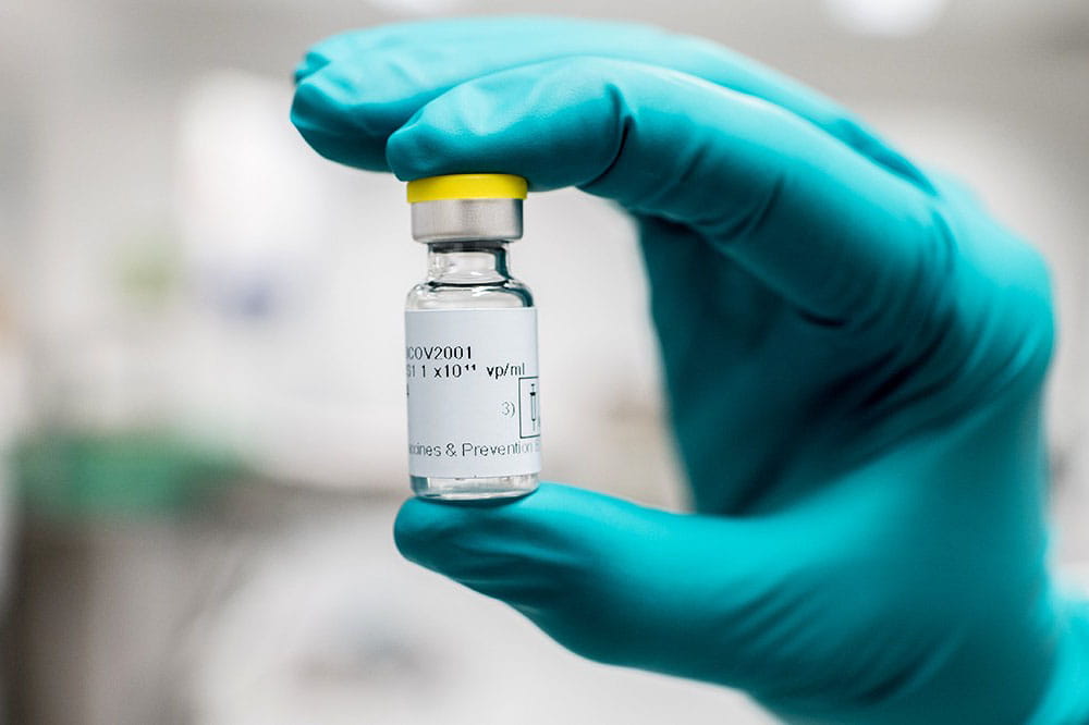Hand holding COVID-19 vaccine by Janssen, part of Johnson and Johnson.
