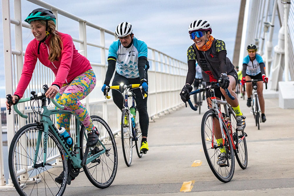 Group of cyclists riding on the Ravenel Bridge in Charleston during Lowvelo 2019