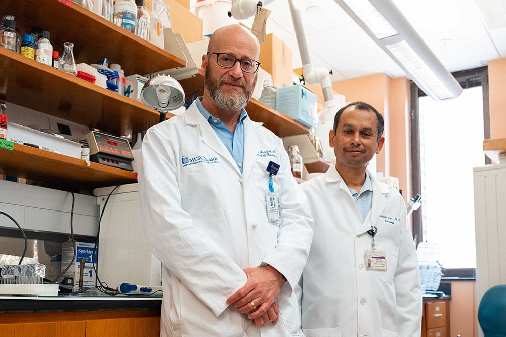 Dr. Bruce Frankel and Dr. Arabinda Das stand together in their lab