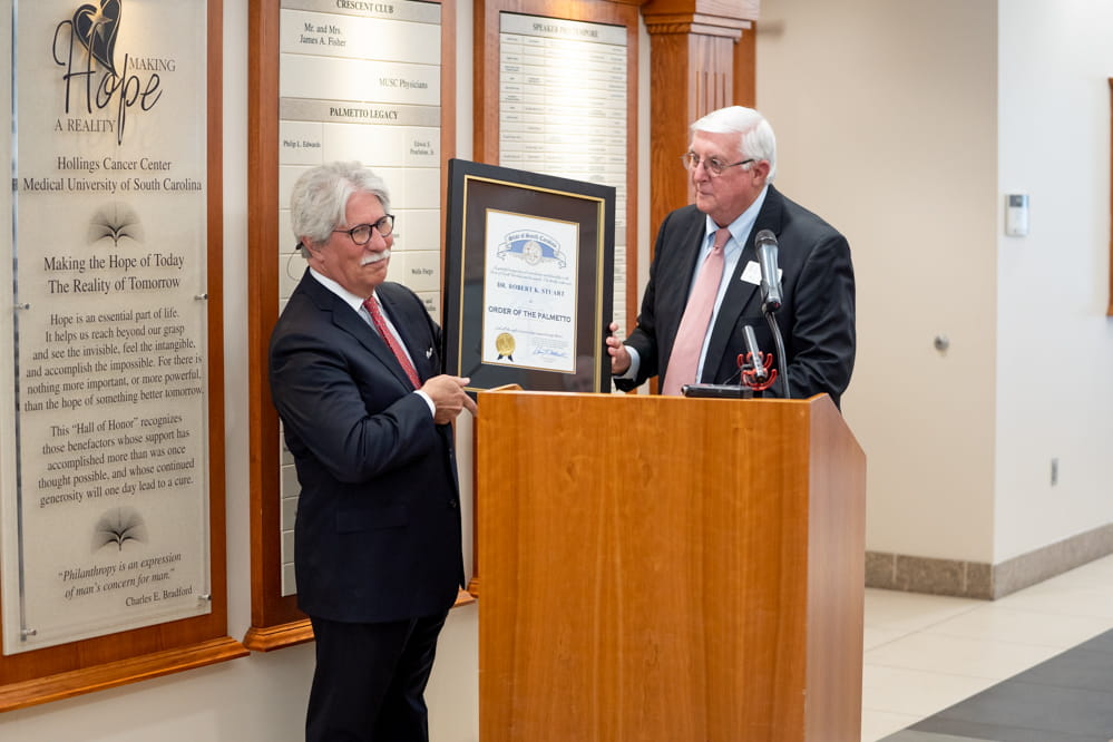 Dr. Robert Stuart receives Order of the Palmetto plaque from former Mount Pleasant mayor Billy Swails