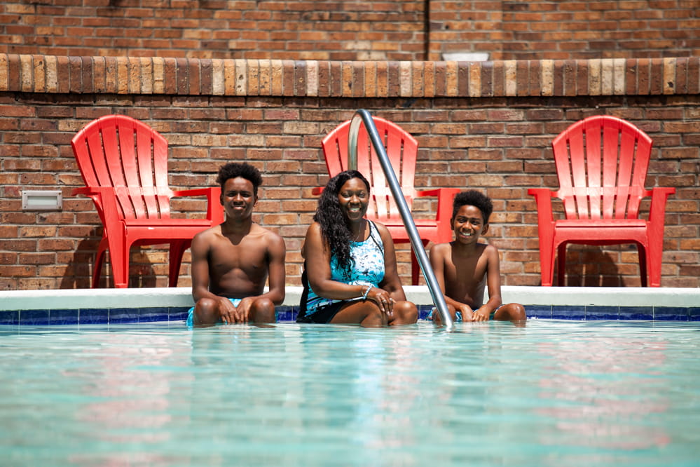 LaToya Wilson and her sons posing for a photo in the pool.