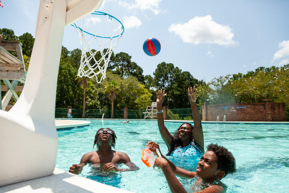LaToya Wilson and her sons playing pool basketball.