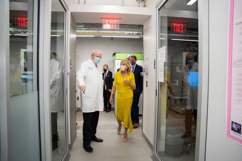 Dr. Raymond N. DuBois leads first lady Dr. Jill Biden on a tour of Hollings research labs