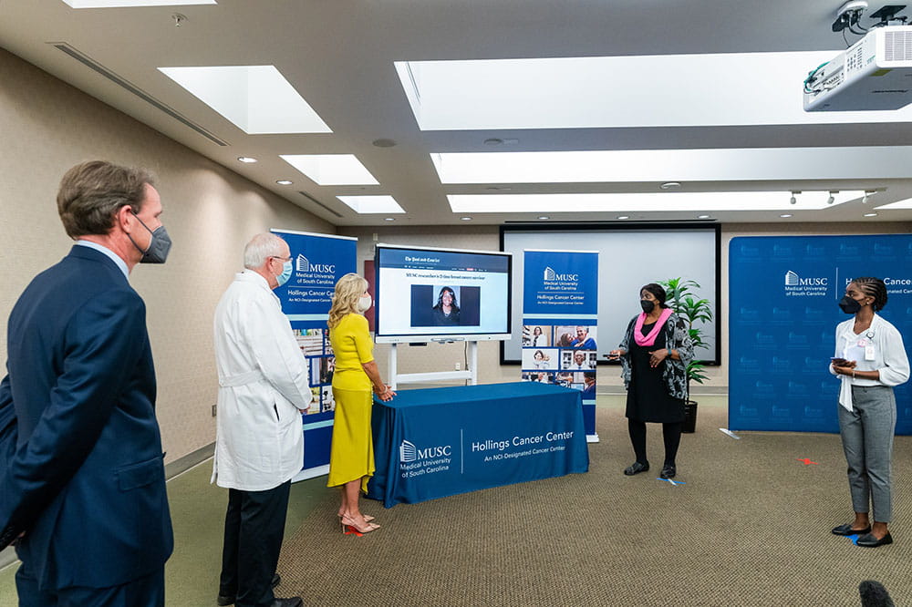 Dr. Marvella Ford gives a presentation to first lady Dr. Jill Biden about Hollings' community outreach efforts while others look on
