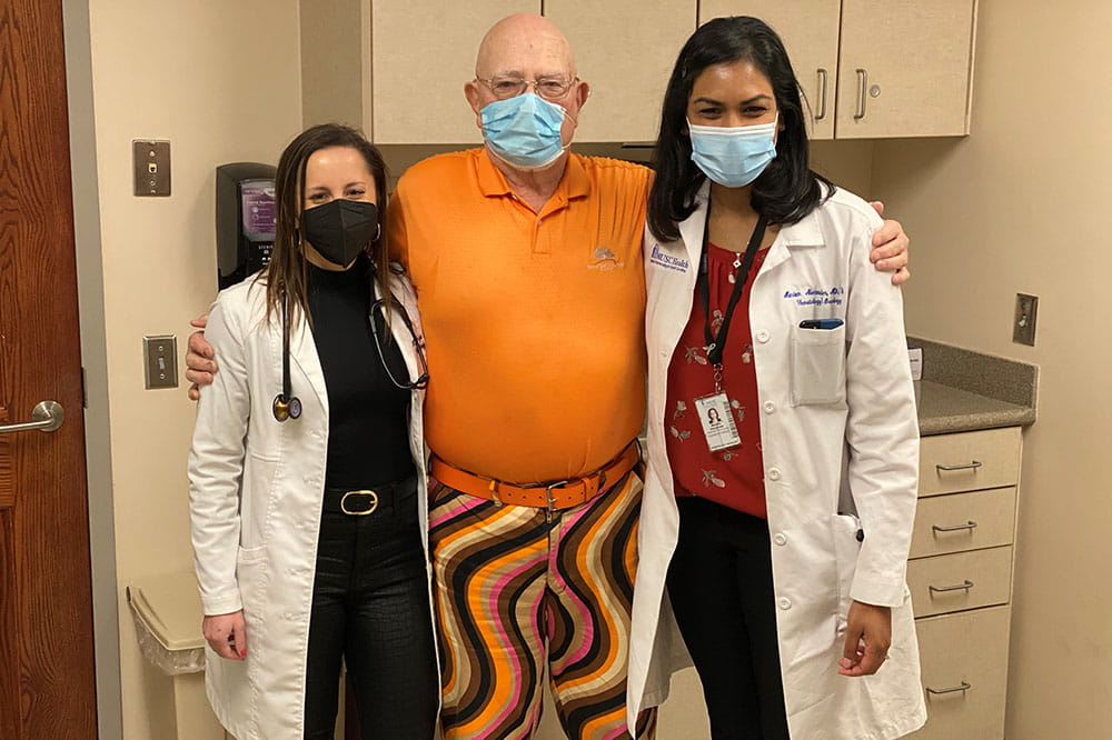 Hollings staff are always happy to see Mr. Nelson, who they call Mr. Fancy Pants. Dr. Mariam Alexander (right) poses with Jim Nelson (center).