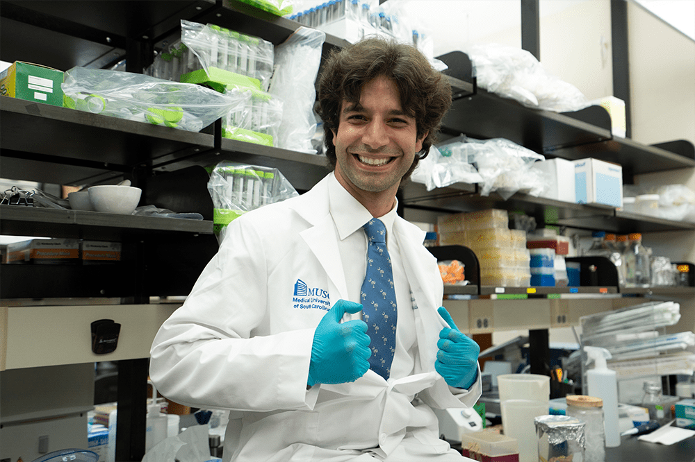 Leonardo Ferreira, Ph.D., sits in his lab