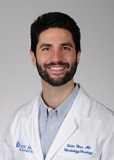 headshot of Dr. Brian Hess in white coat