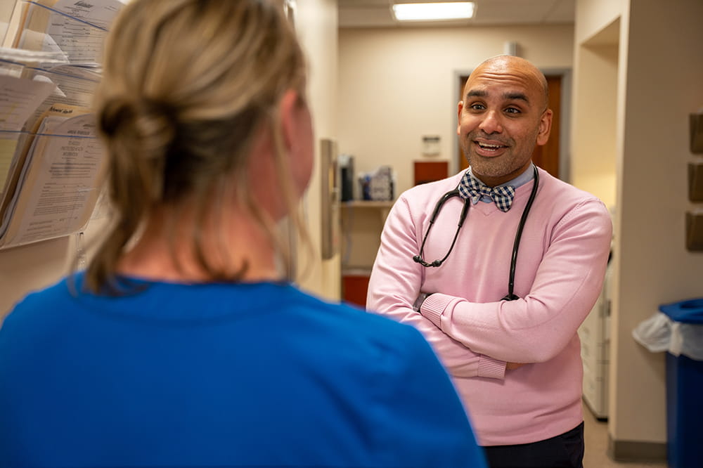 Dr Hamza Hashmi chats with a nurse
