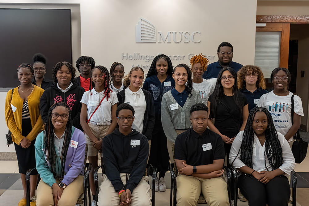 group photo of students from four Charleston County high schools studying at MUSC Hollings Cancer Center for the summer