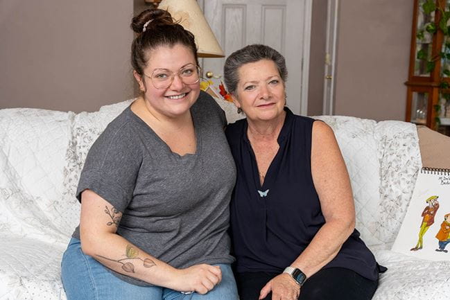 image of two women on sofa