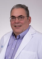 headshot of radiation oncologist Brian Lally