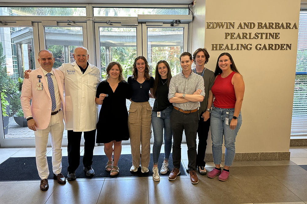 group photo of students and faculty members at Hollings Cancer Center