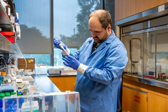 a researcher working at a lab bench