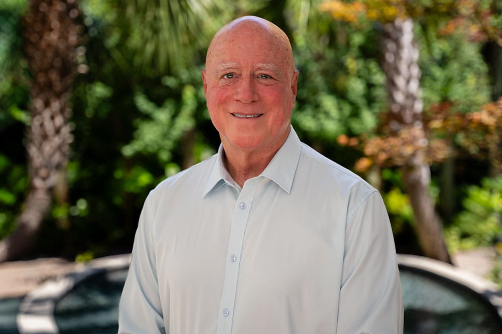  a patient poses in the Hollings garden
